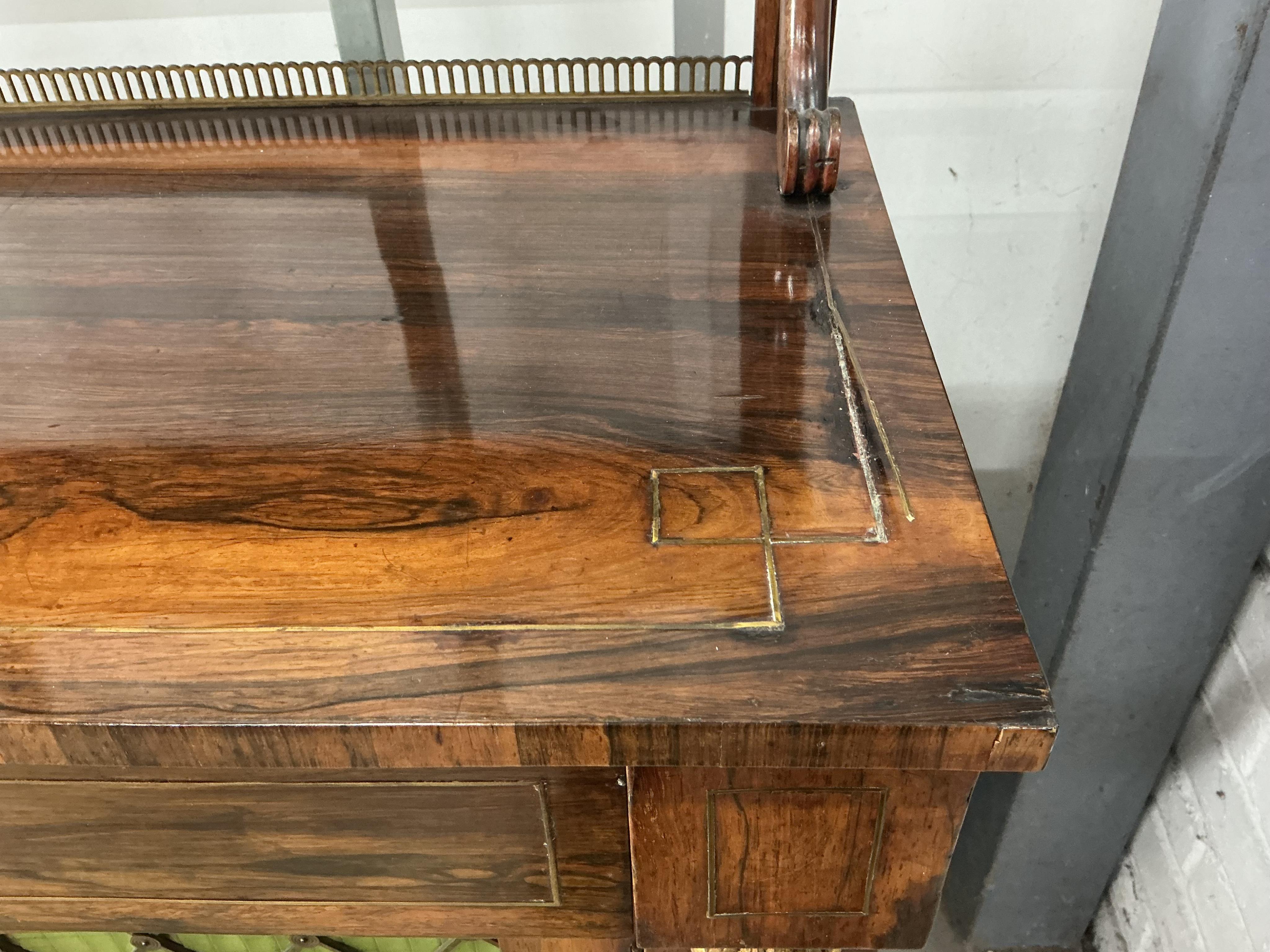 A Regency brass strung rosewood chiffonier, width 106cm, depth 39cm, height 117cm